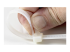 StarTech.com 10"(25cm) Reusable Cable Ties, 1/4"(7mm) wide, 2-1/2"(65mm) Bundle Dia. 50lb(22kg) Tensile Strength, Releasable Nylon Ties, Indoor/Outdoor, 94V-2/UL Listed, 100 Pack, White - Close up
